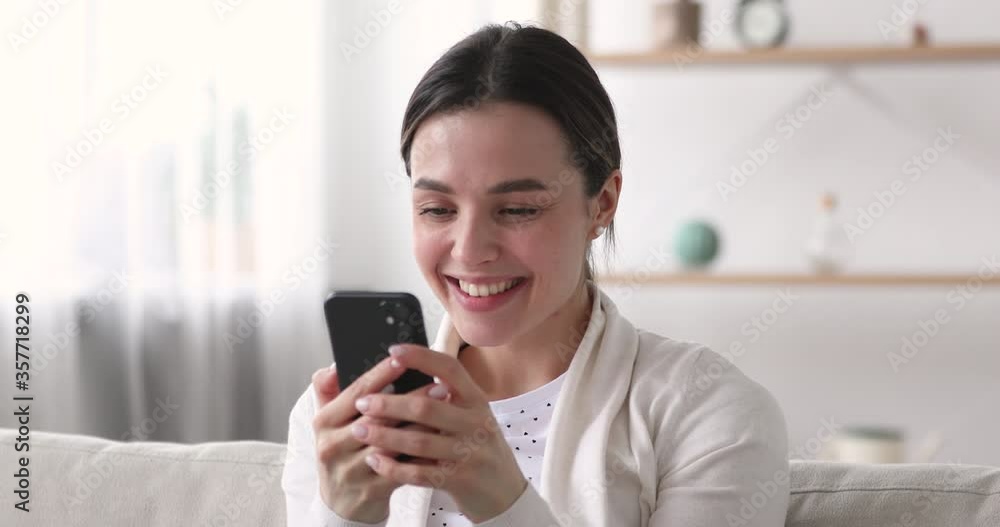 Close up head shot excited young pretty girl received sms win notification on cellphone. Euphoric millennial woman reading message with good news, celebrating success. Female shopper got promo code. Close up head shot excited young pretty girl received sms win notification on cellphone. Euphoric millennial woman reading message with good news, celebrating success. Female shopper got promo code.