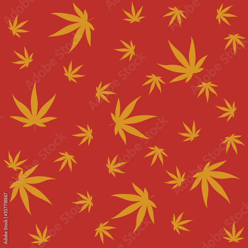 cannabis leafs in motion falling on orange