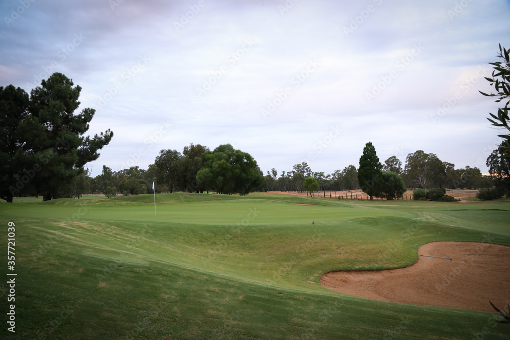 Sweeping greens of empty golf course