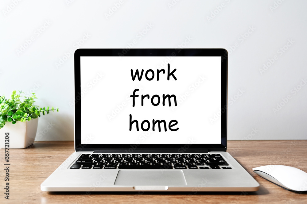 work from home word on Laptop monitor In the office work from home word on Laptop monitor In the office