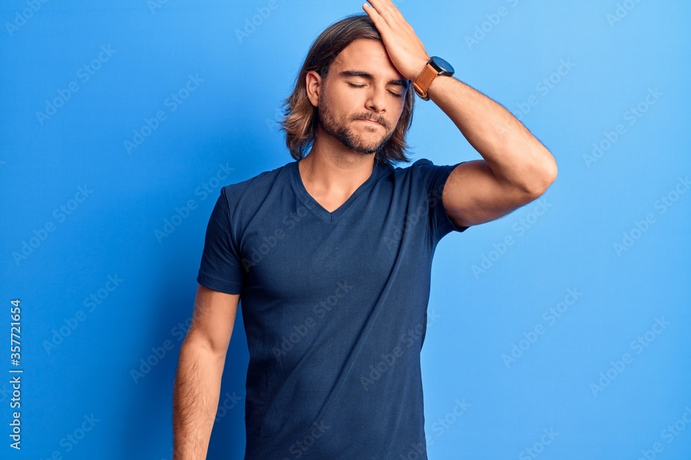 Young handsome man wearing casual clothes surprised with hand on head for mistake, remember error. forgot, bad memory concept. Young handsome man wearing casual clothes surprised with hand on head for mistake, remember error. forgot, bad memory concept.