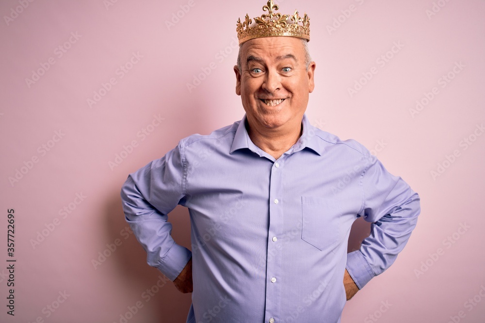 Middle age hoary man wearing golden crown of king standing over isolated pink background with a happy and cool smile on face. Lucky person. Middle age hoary man wearing golden crown of king standing over isolated pink background with a happy and cool smile on face. Lucky person.