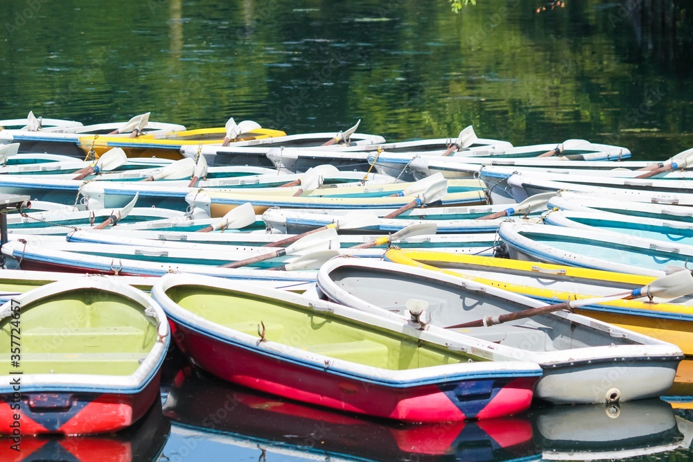 Colourful wooden boats on a lake
