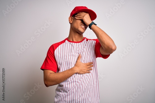 Canvas Print Young handsome african american sportsman wearing striped baseball t-shirt and c
