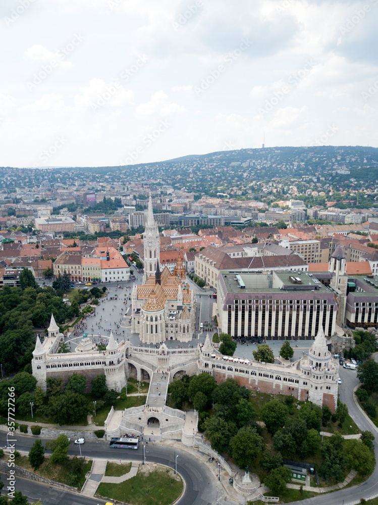 Aerial view of Matthias Church in historic centre square of Budapest, Hungary. Europe. Summer. Fisherman's bastion (Halászbástya). Christian catholic church in gothic style.
