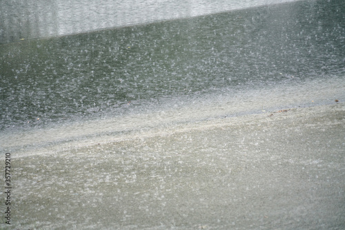 close up on raining street in thunderstorm