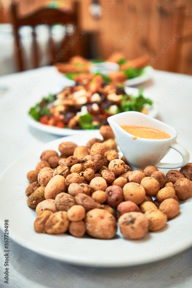 Delicious plate with potatoes and sauce Delicious plate with potatoes and sauce