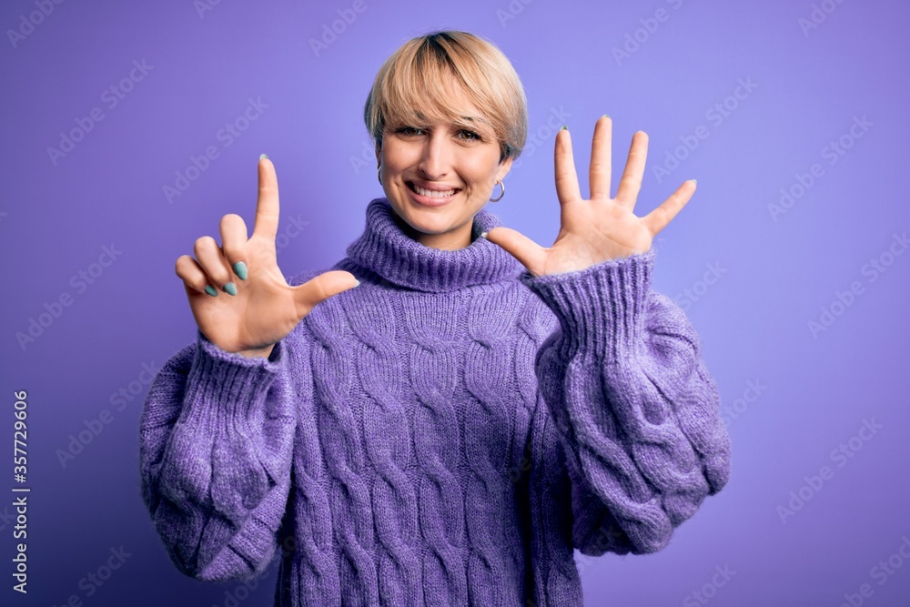Young blonde woman with short hair wearing winter turtleneck sweater over purple background showing and pointing up with fingers number seven while smiling confident and happy. Young blonde woman with short hair wearing winter turtleneck sweater over purple background showing and pointing up with fingers number seven while smiling confident and happy.