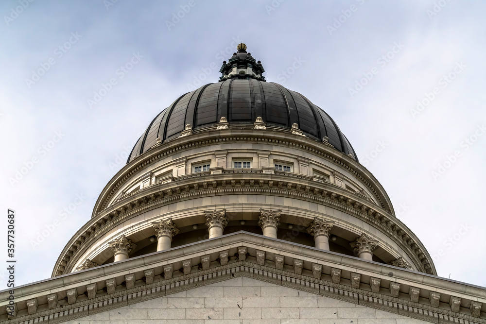Dome and pediment of Utah State Capital building in Salt Lake City against sky