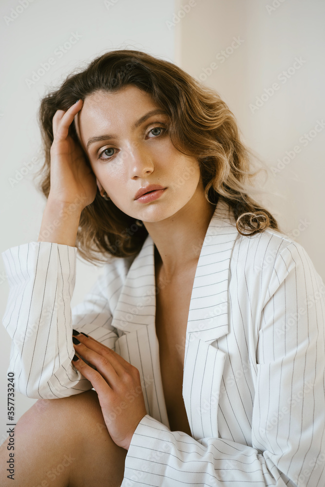 Portrait of young attractive woman in white jacket Portrait of young attractive woman in white jacket