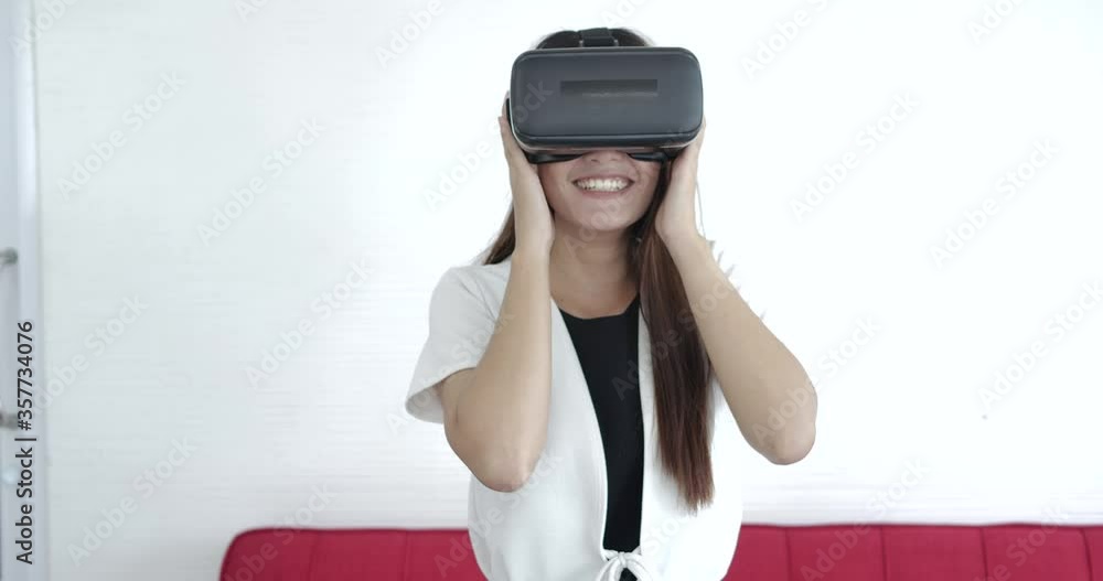 girl using a virtual reality glasses at home girl using a virtual reality glasses at home