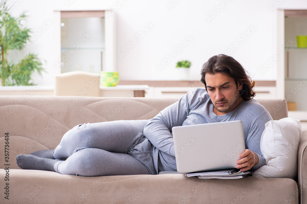 Young male employee freelancer working from home Young male employee freelancer working from home