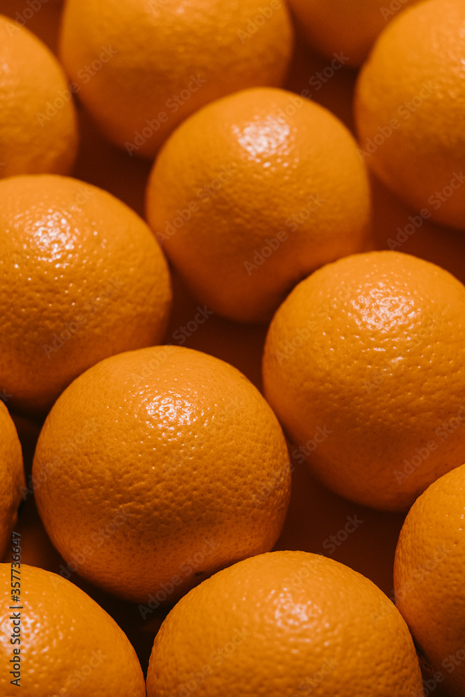 close up row of fresh oranges. angled top view