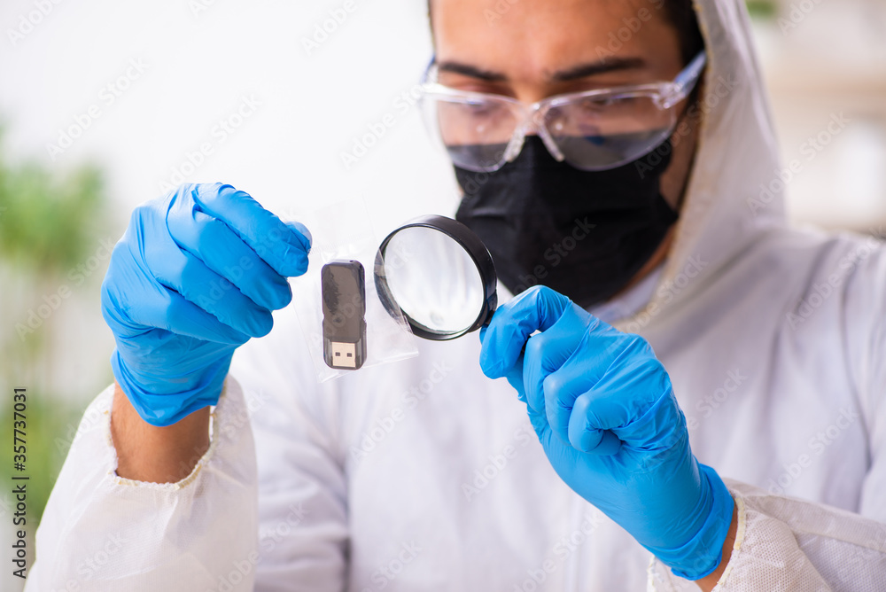 Male expert criminologist working in the lab for evidence Male expert criminologist working in the lab for evidence