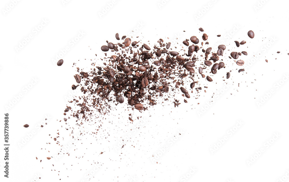 Coffee bean broken splash explosion in the air isolated on white background photo stop motion Coffee bean broken splash explosion in the air isolated on white background photo stop motion