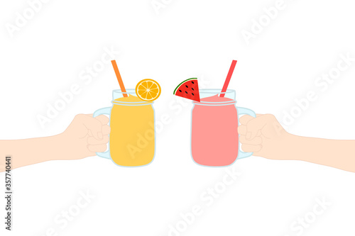 2 Hands are holding​ a smoothie juice in a glass cup with and has fruit slice on top (orange and watermelon). The cold beverage for the summer season. Healthy and organic drink.