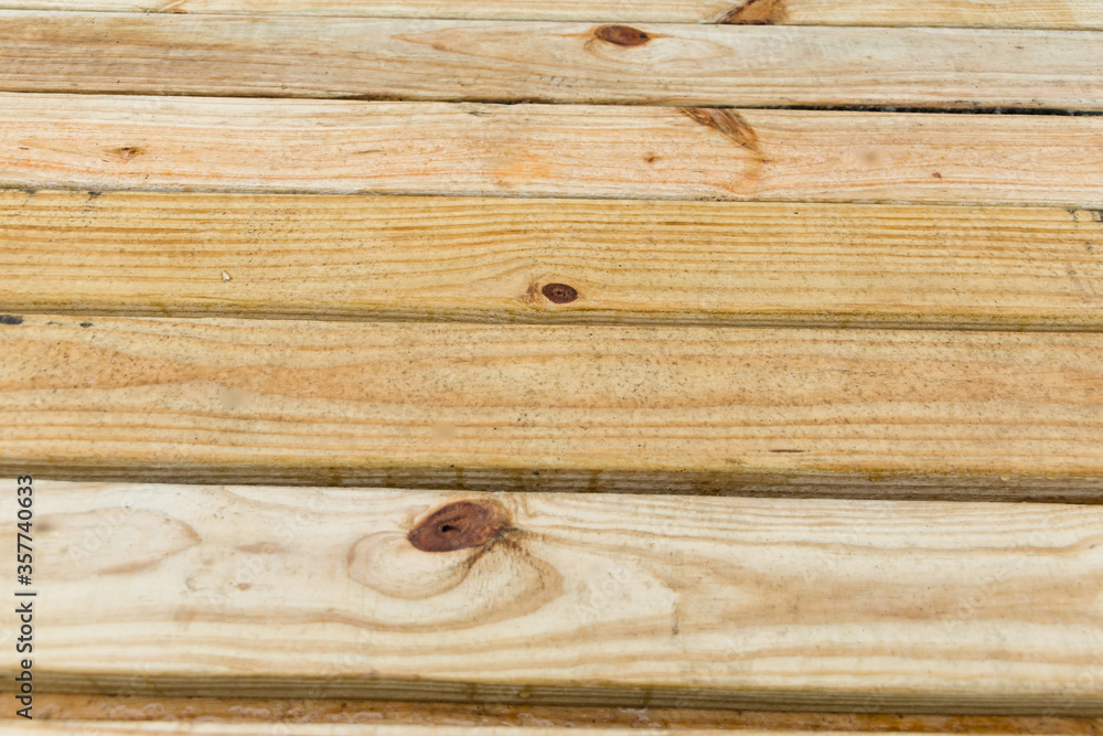 close up of a pile of treated lumber 2x4's at a building site Stock Photo