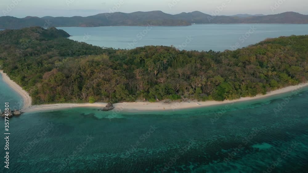 Approaching Gintu Island beach in the Linapacan archipelago Philippines, Aerial lowering close in shot Approaching Gintu Island beach in the Linapacan archipelago Philippines, Aerial lowering close in shot