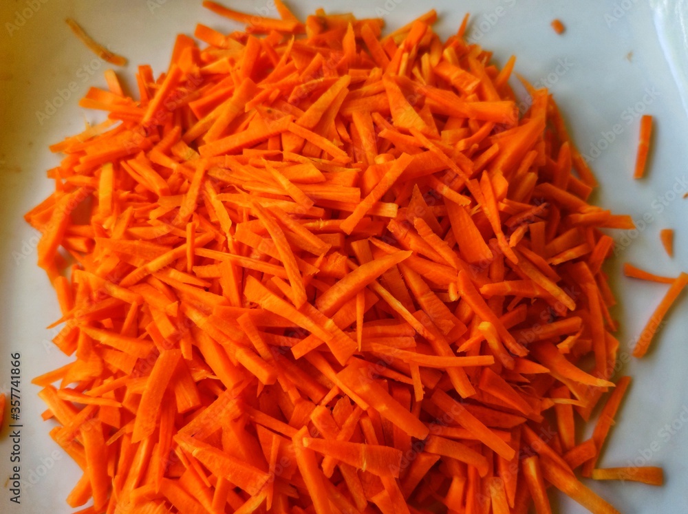 grated carrots on a plate grated carrots on a plate