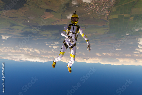 Girl performs skydiver in freefall figure. © German Skydiver