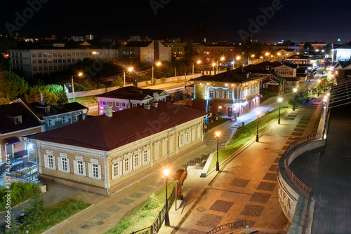 Irkutsk, Russia, June, 14, 2020: 130 Kvartal quarter, Irkutsk Sloboda is a specially created area of historic buildings in the center of Irkutsk at night, Russia.