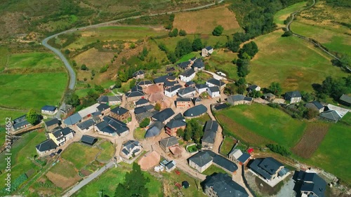 Beautiful village of Balouta with traditional houses in the green fields of Leon,Spain. Drone view photo