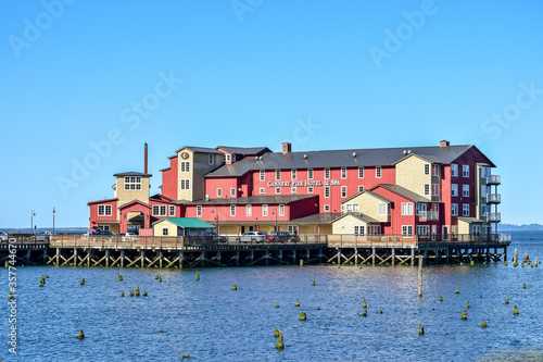 Red hotel building on Columbia River on the coast of Astoria, Oregon