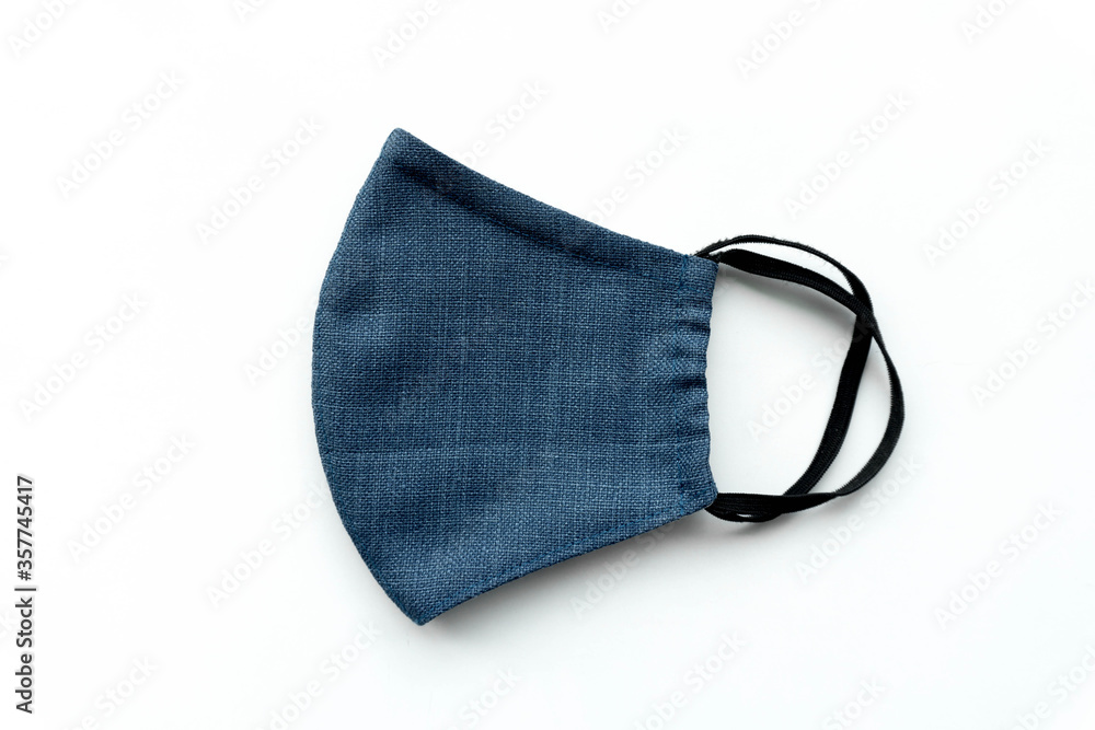 Top view blue fabric mask on white background Top view blue fabric mask on white background