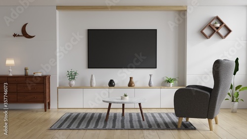 Large TV in the living room on the white wall has a sofa in front decorated with beautiful vases.3D Rendering.