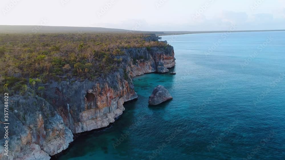 Aerial backward of high rocky cliffs of Eagles Bay in Dominican Republic Aerial backward of high rocky cliffs of Eagles Bay in Dominican Republic