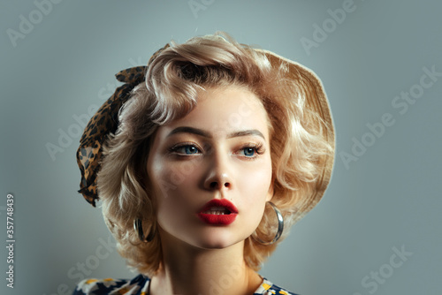 Pin up girl vintage. Beautiful woman pin up style portrait in retro makeup. Red lips Portrait of beautiful young woman. Pin-up style.
