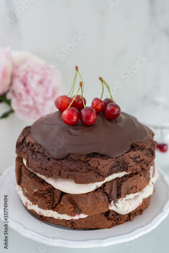 black forest chocolate cake with cherry pie filling with dark chocolate glaze