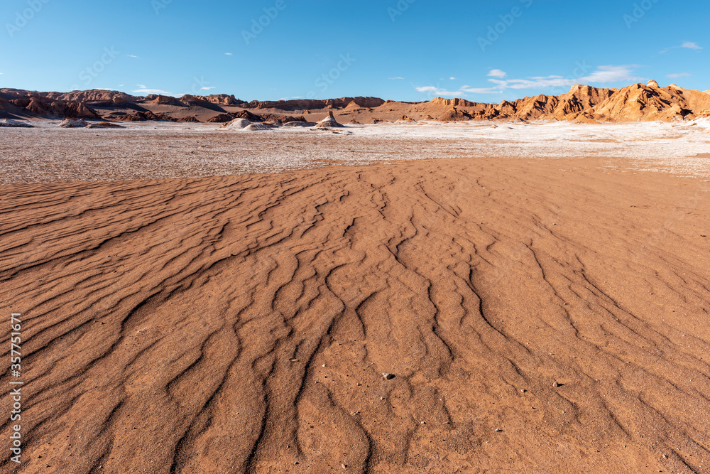 A dry riverbed landscape in the arid Moon Valley of the driest desert on earth, Atacama Desert, Chile.