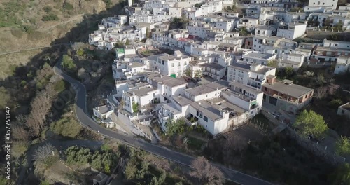 Sierra Nevada (Spain) mountain range town & orchards with drone shot in 4k