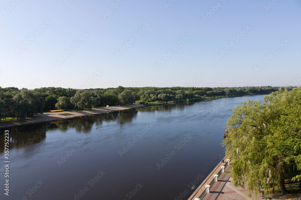 View of the river from the bridge. Panoramic view of the river and embankment. View of the river from the bridge. Panoramic view of the river and embankment.
