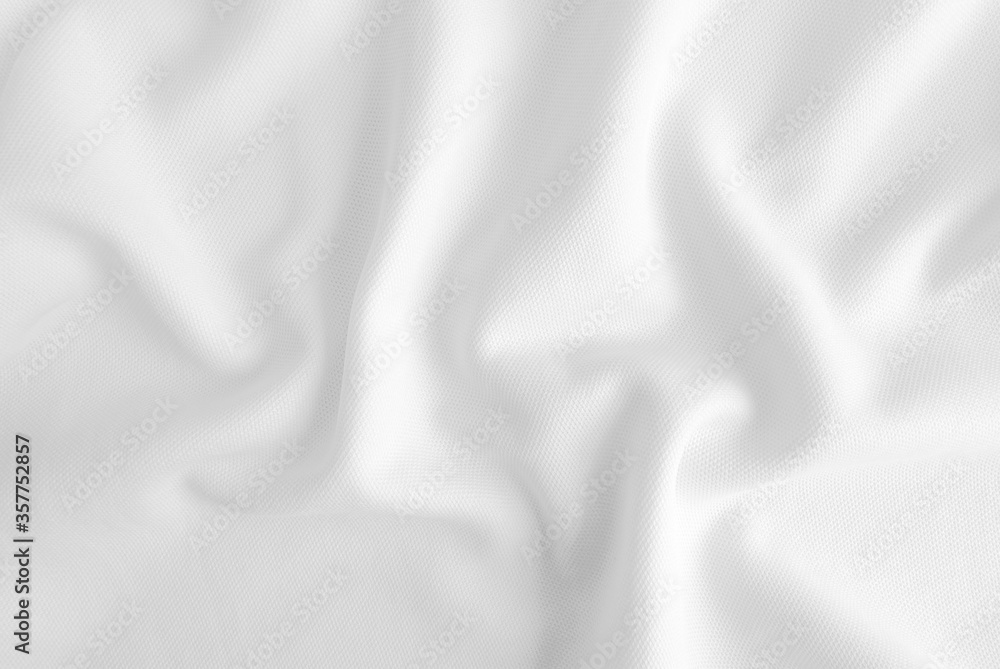 Fototapeta premium White abstract folded clothes background, fabric texture