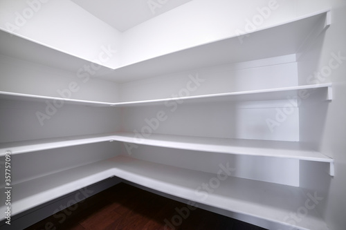 Wallpaper Mural Empty white fitted shelves in an interior room Torontodigital.ca