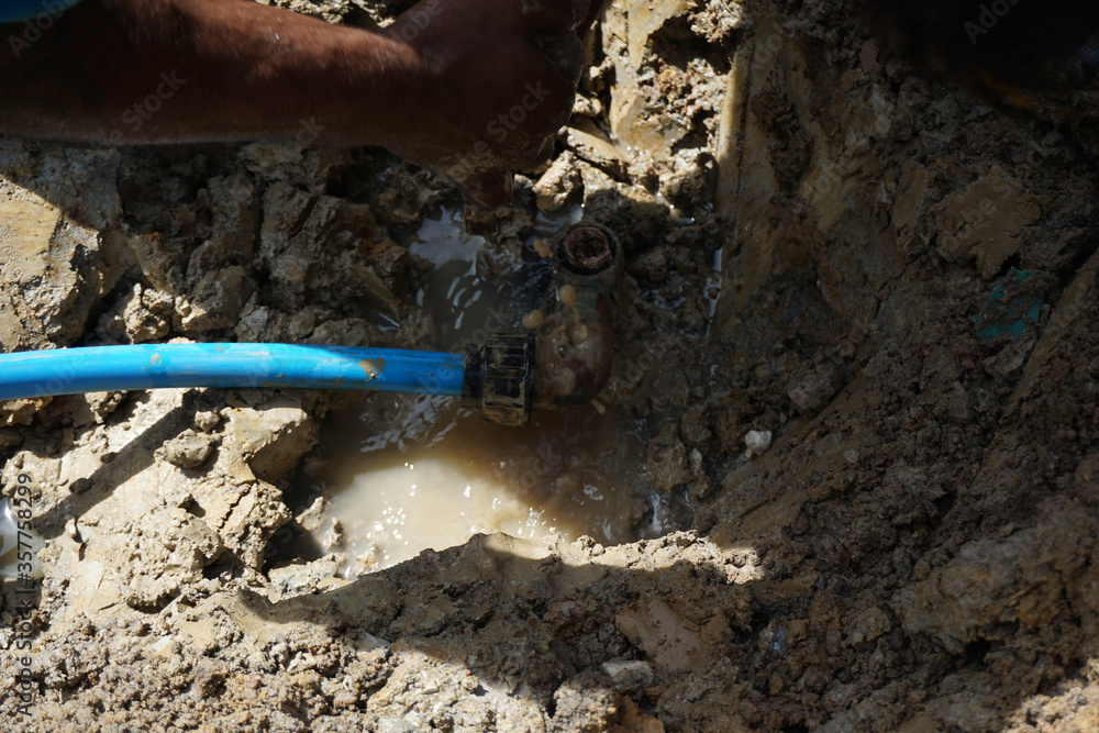 HDPE pipe leaking on ferrule connection is being repaired HDPE pipe leaking on ferrule connection is being repaired