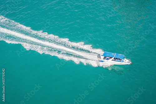 Aerial view of small boat flowing in sea, travel and vacation concept © galitskaya