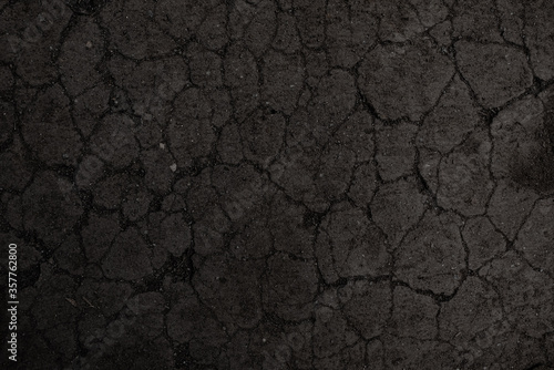 Black cracked soil texture background