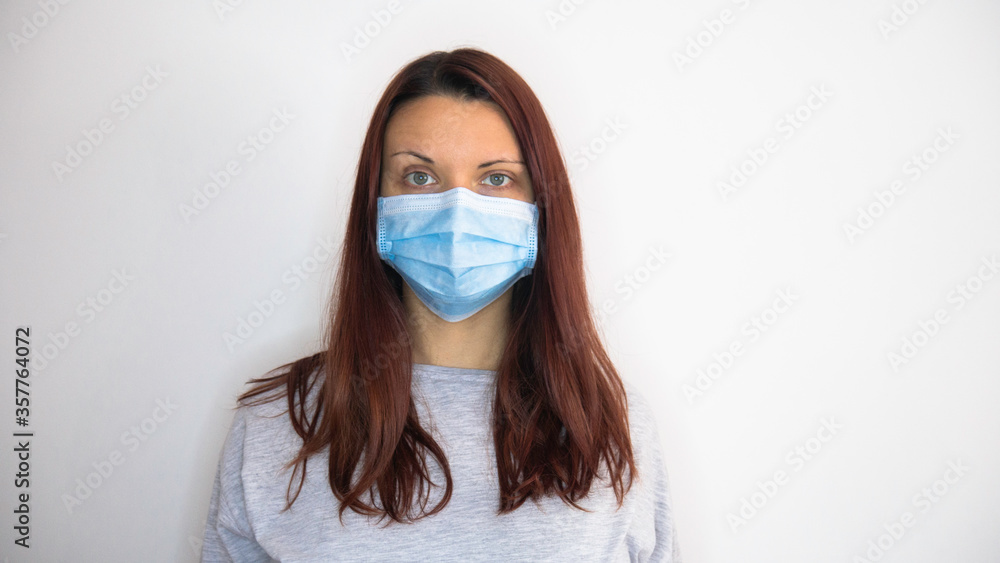 Portrait of a woman with a protective mask - Negative space. Copy space for text. Portrait of a woman with a protective mask - Negative space. Copy space for text.