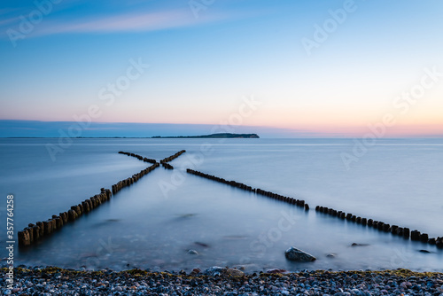Fototapeta Naklejka Na Ścianę i Meble -  jetty at sunset at the baltic sea