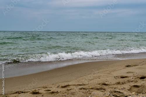 Sea view from tropical beach with sunny sky.