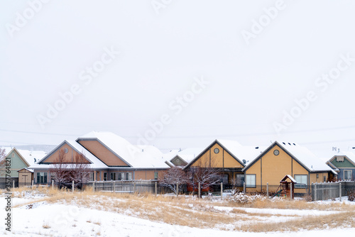 Residential community on a frosty landscape covered with snow in winter © Jason
