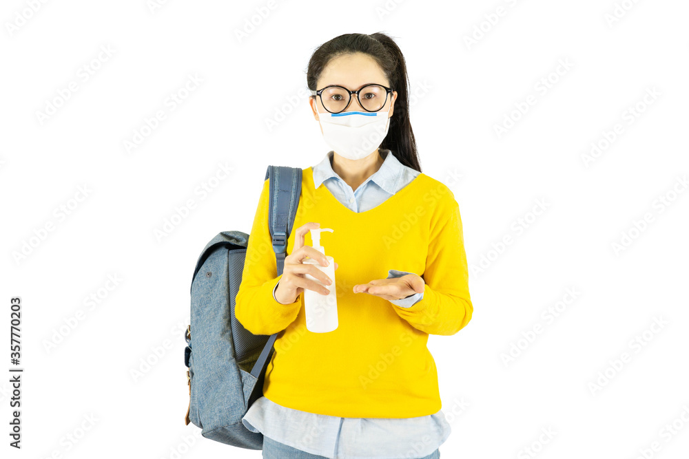 Young asian student woman in glasses wearing medical face mask,carrying a bag and laptop to go to school Under the outbreak of the virus isolated on white background Young asian student woman in glasses wearing medical face mask,carrying a bag and laptop to go to school Under the outbreak of the virus isolated on white background