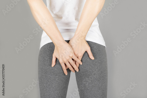 Fotografija Hands holding bottom isolated on gray background,health care concept