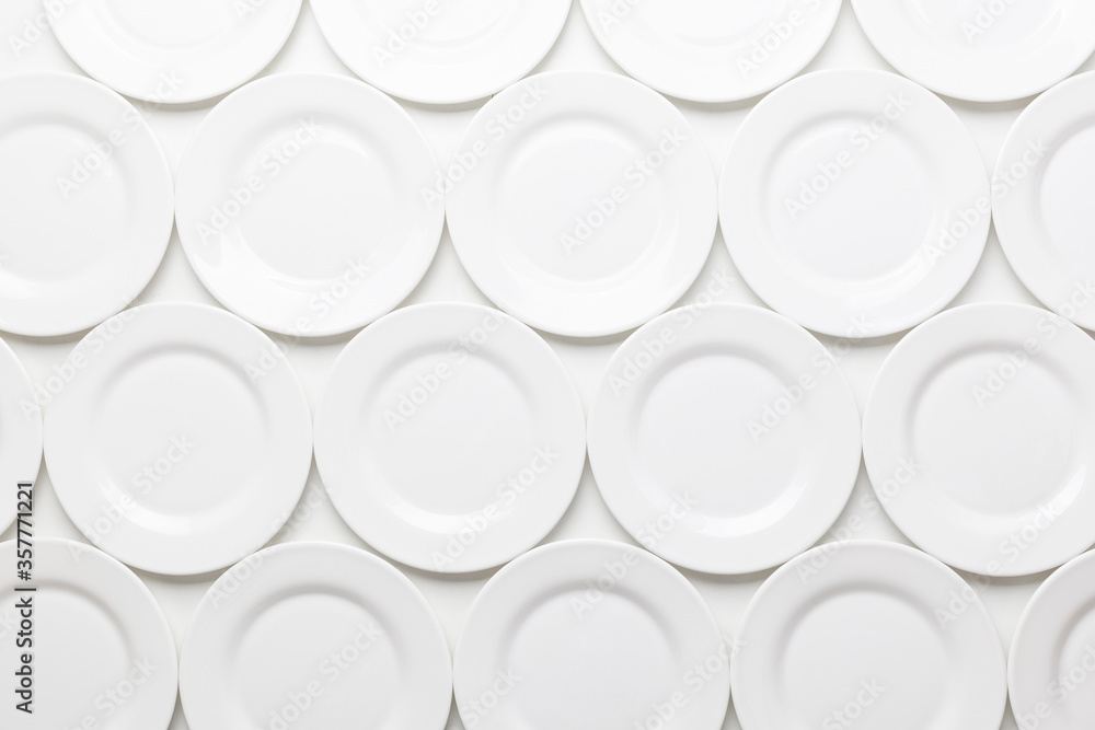 White round plates pattern, isolated on white background White round plates pattern, isolated on white background