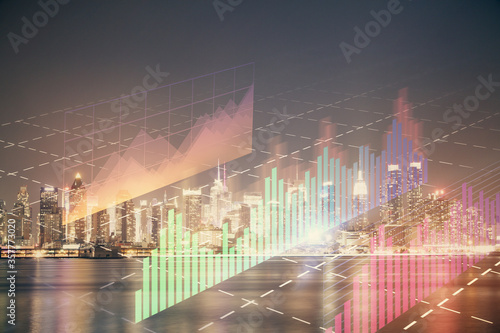 Financial graph on night city scape with tall buildings background multi exposure. Analysis concept. © peshkova