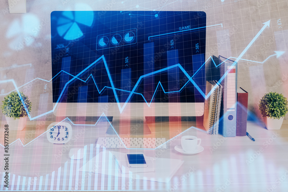 Forex graph hologram on table with computer background. Double exposure. Concept of financial markets. Forex graph hologram on table with computer background. Double exposure. Concept of financial markets.