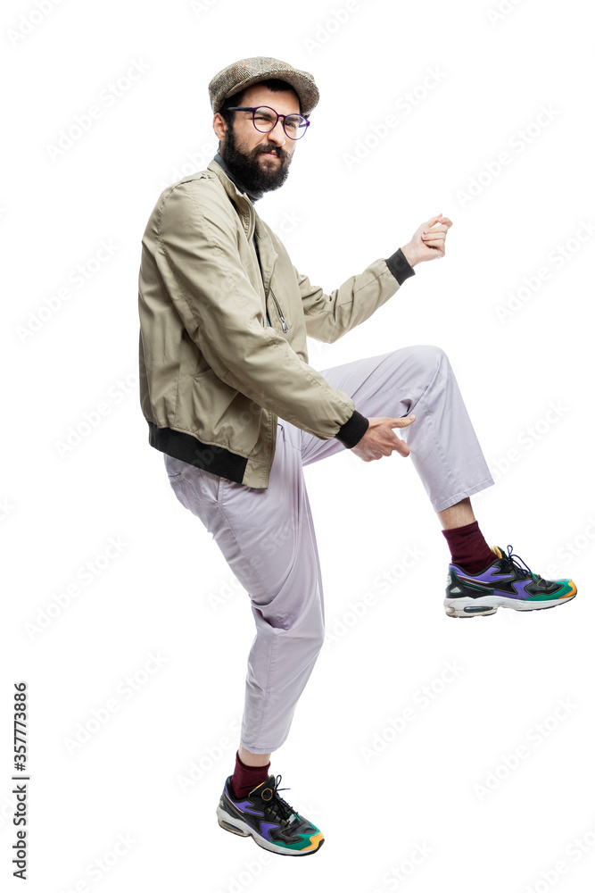 A young man emotionally imitates playing a guitar. Full height. Isolated on a white background. Vertical. A young man emotionally imitates playing a guitar. Full height. Isolated on a white background. Vertical.